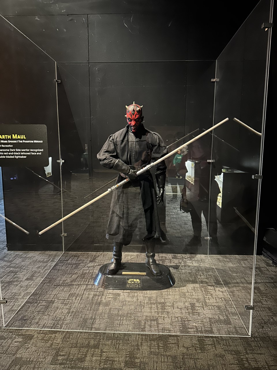 Darth Maul with his double-bladed lightsaber and distinctive red and black face tattoos