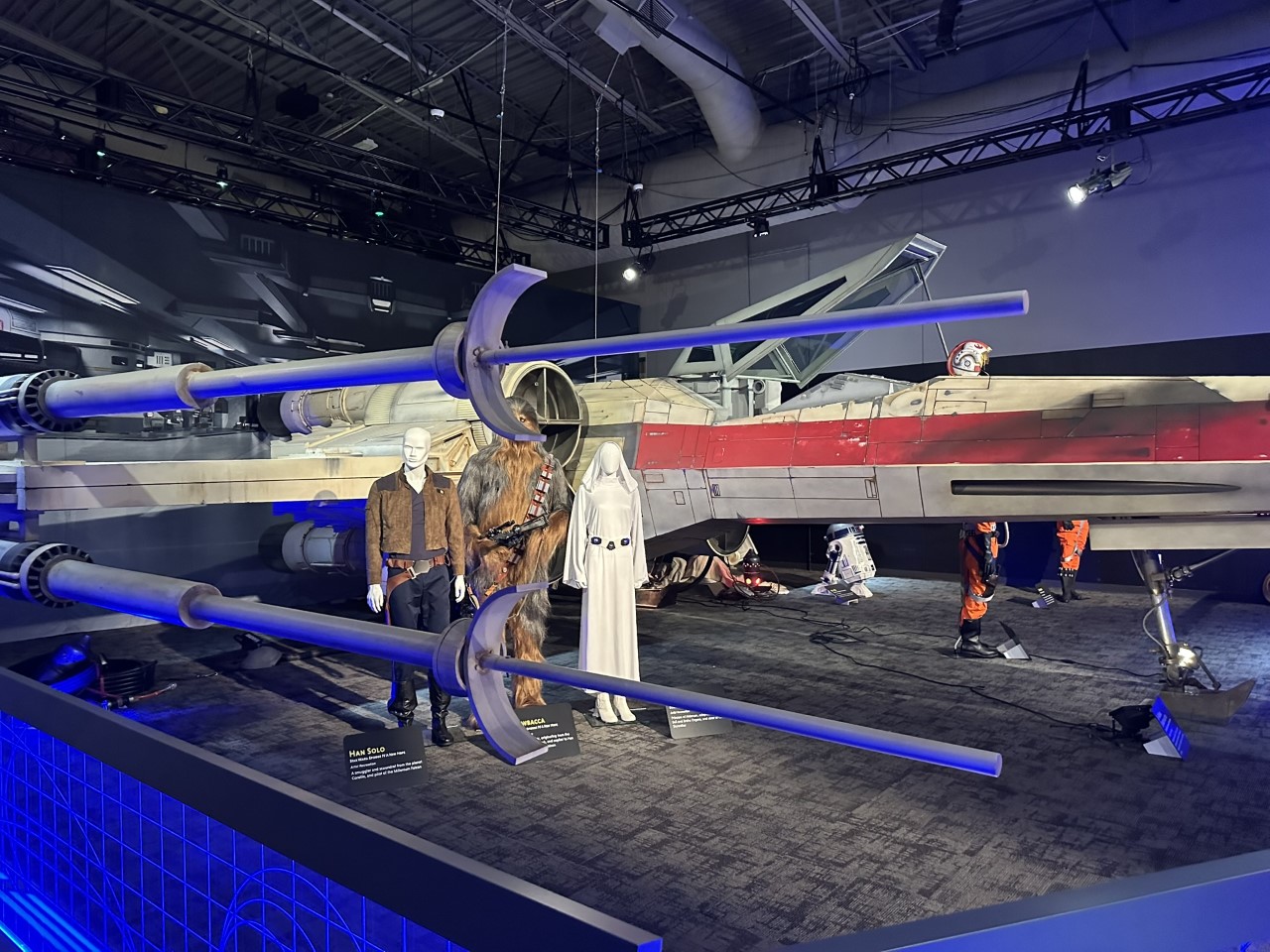 X-wing fighter centerpiece with Han Solo, Chewbacca, and Princess Leia costumes