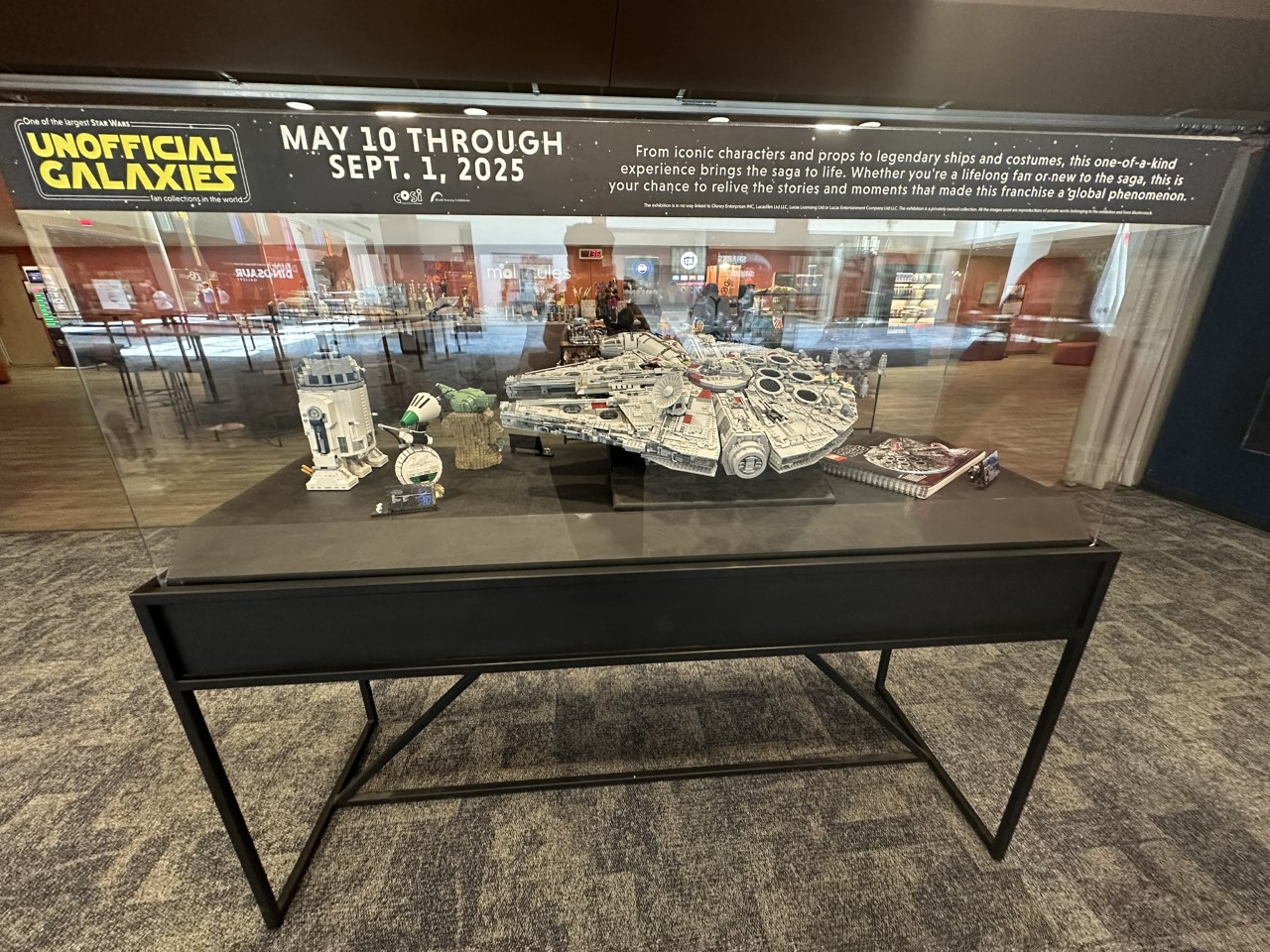 LEGO Star Wars display featuring Millennium Falcon and other iconic builds from Unofficial Galaxies exhibit